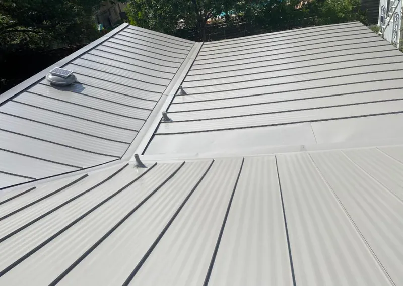 Solar attic fan installed on a metal roof for Roof Ventilation in James Island